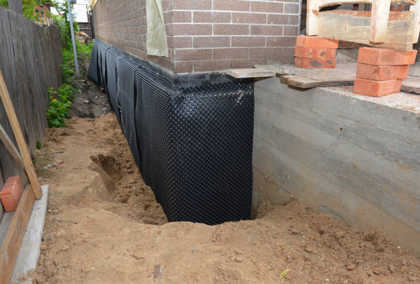 Happy homeowners after waterproofing job in East Chicago